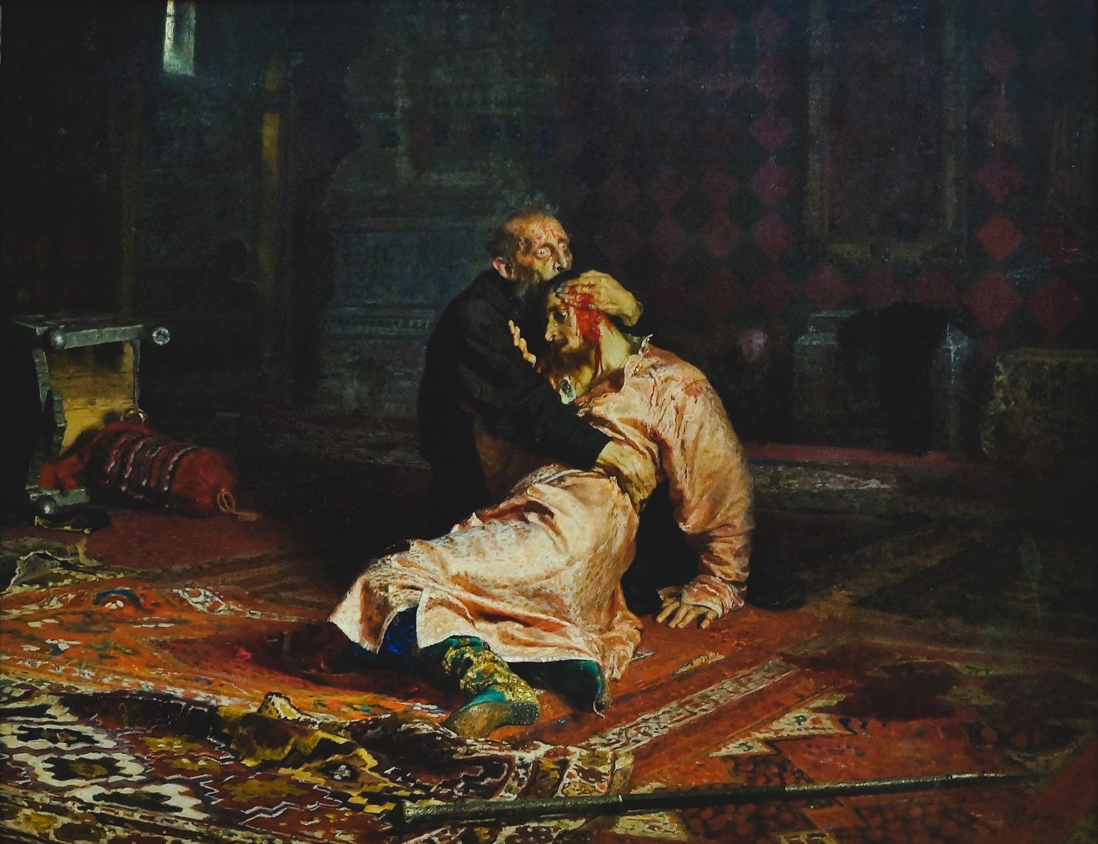 Ilya Repin's painting of Ivan the Terrible on the floor of a dark red chamber, clutching his dying son, blood running from the young man's temple, the tsar's eyes wide with horror.